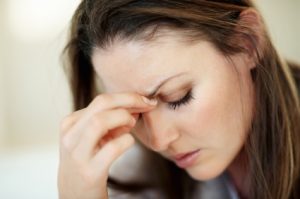 Closeup of woman suffering from headache